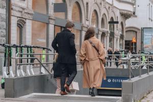 a man and a woman walking down a street at Story Hotel Riddargatan, part of JdV by Hyatt in Stockholm