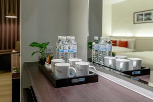 a bottle of water sitting on top of a table at 53 Hotel in Taichung