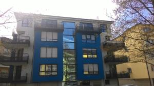 a blue building with balconies on the side of it at Topfloor Luxembourg Ville in Luxembourg
