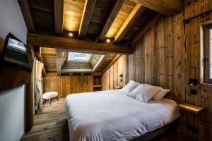 Postel nebo postele na pokoji v ubytování Chalet Prestige Valmorel