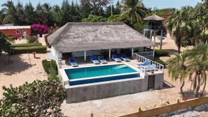 an aerial view of a villa with a swimming pool at la villa sur la plage in Palmarin