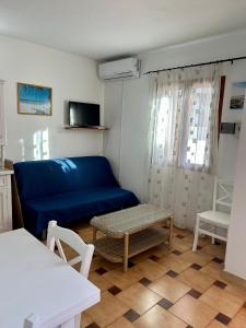 Ένα ή περισσότερα κρεβάτια σε δωμάτιο στο Grazioso trilocale a Porto Ottiolu