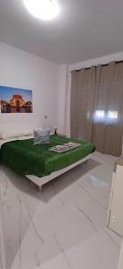 Ένα ή περισσότερα κρεβάτια σε δωμάτιο στο Villa Tàsca Apartment