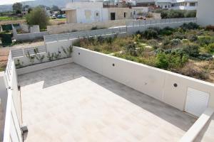 A balcony or terrace at Villa Constantino with heated pool