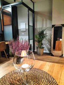 a wine glass sitting on top of a table at Loft Coruña Mar in A Coruña