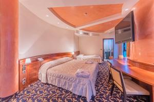 Postel nebo postele na pokoji v ubytování Dado Hotel International + 37 fotografií