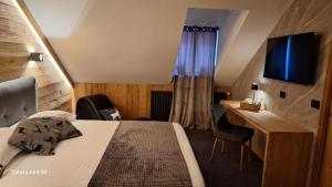 TV a/nebo společenská místnost v ubytování Hotel Valle Pesio Ristorante