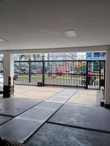 an empty room with a balcony with a iron gate at Alquilo Dpto Equipado San Isidro in Lima