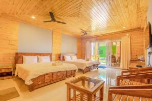 Кровать или кровати в номере The O2H Agonda Beach Resort +37 фотографий