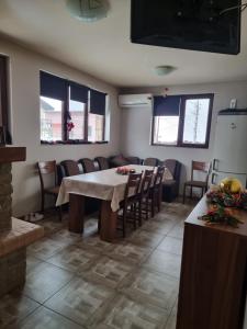 a dining room with a table and chairs at Andreevite Houses in Sapareva Banya