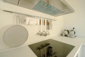 a kitchen counter with a sink and a mirror at Borgo Antico - Casa White Tellaro P1 in Tellaro +37 photos