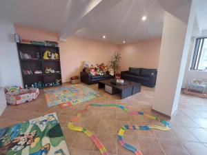 a living room with a couch and a table at Pamporovo Rhodopi Pearl Apartments - Private Apartments in Pamporovo