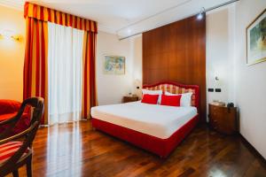 Postel nebo postele na pokoji v ubytování Hotel Royal Torino Centro Congressi