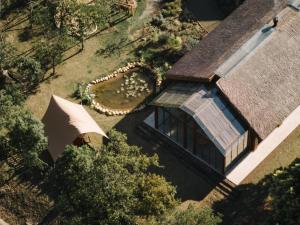 an overhead view of a house with an umbrella at Somland Resort in Paiya