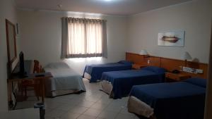 TV a/nebo společenská místnost v ubytování Jaguary Hotel Sumaré