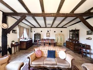 a living room with a couch and a table at Saschiz 130/Lodging and Glamping in Saschiz