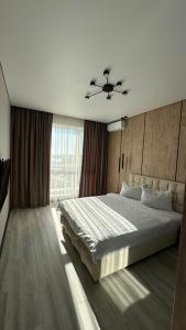 Ένα ή περισσότερα κρεβάτια σε δωμάτιο στο Exclusive apartment & ЖК Театральний ЦЕНТР& АВТОВОКЗАЛ ЖК Great House Обласна лікарня