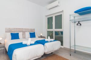 Postel nebo postele na pokoji v ubytování Moreno Rooms