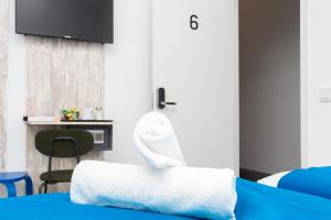 Postel nebo postele na pokoji v ubytování Moreno Rooms