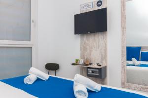 Postel nebo postele na pokoji v ubytování Moreno Rooms