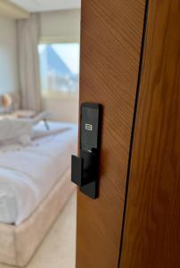 Postel nebo postele na pokoji v ubytování Tiye Pyramids Hotel