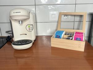 a coffee maker sitting on a counter next to a box at Studio lumineux sans vis a vis avec balcon privé in Chelles