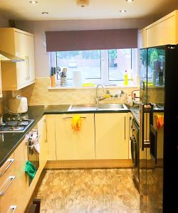 a kitchen with a sink and a counter top at Cosy 3 Bed House at CityCentre & Garden & FreeParking in Newcastle upon Tyne