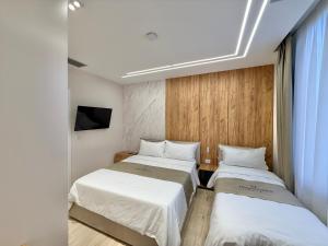 Postelja oz. postelje v sobi nastanitve Downtown Hotel