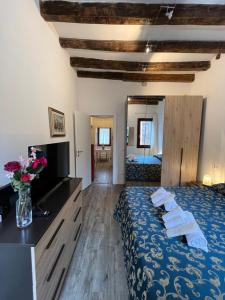 a hotel room with a bed with towels on it at Cozy apartment close to Biennale of Venice in Venice