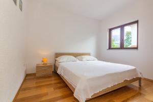 Ένα ή περισσότερα κρεβάτια σε δωμάτιο στο Holiday home Maja +36 φωτογραφίες
