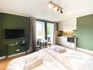 Η κουζίνα ή μικρή κουζίνα στο Ferienapartment Alte Bücherei +12 φωτογραφίες