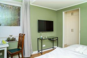 Μια τηλεόραση ή/και κέντρο ψυχαγωγίας στο Ferienapartment Alte Bücherei
