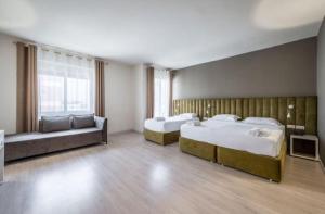 Postel nebo postele na pokoji v ubytování Ajsel Hotel