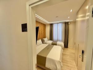 Postelja oz. postelje v sobi nastanitve Downtown Hotel
