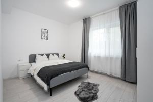 Ένα ή περισσότερα κρεβάτια σε δωμάτιο στο Casa Magurele 6