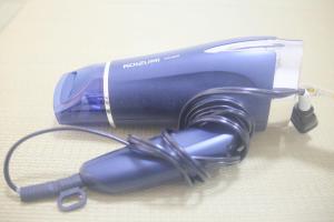 a blue hair dryer sitting on a table at 花乃郷 赤羽 in Tokyo