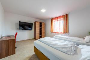Postel nebo postele na pokoji v ubytování YS Apartments