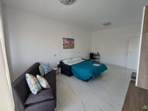 Ένα ή περισσότερα κρεβάτια σε δωμάτιο στο Villa Tàsca Apartment