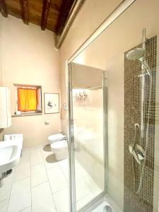 a bathroom with a glass shower and a toilet at B&B L'Argonauta in Cremona +37 photos