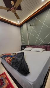 Postel nebo postele na pokoji v ubytování Hotel Mahika