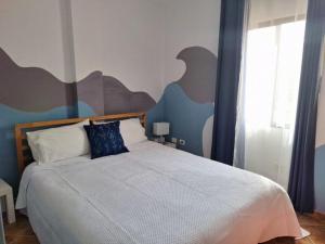 A bed or beds in a room at Accommodation Madre Amada Tenerife