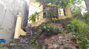 a house on top of a brick wall with a window at Two Friendly Room in Hai Phong