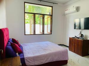 Postel nebo postele na pokoji v ubytování Asirima Villas + 27 fotografií