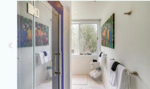 a bathroom with a shower with a glass door at Cozy Mountain Home in the Catskills - Fall Views & Trails in Elka Park +47 photos