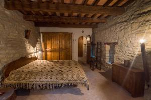 Voodi või voodid majutusasutuse Borgo Corniola B&B Naturista toas