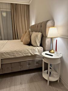 En eller flere senge i et værelse på Boutique apartment