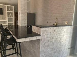 Kuchyň nebo kuchyňský kout v ubytování Hôtel Mon Royaume