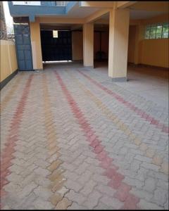 an empty room with red and pink lines on the floor at Nest and key in Nguluni