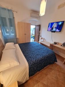Postel nebo postele na pokoji v ubytování Albergo Genio