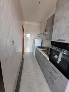 A kitchen or kitchenette at A Casa Tua